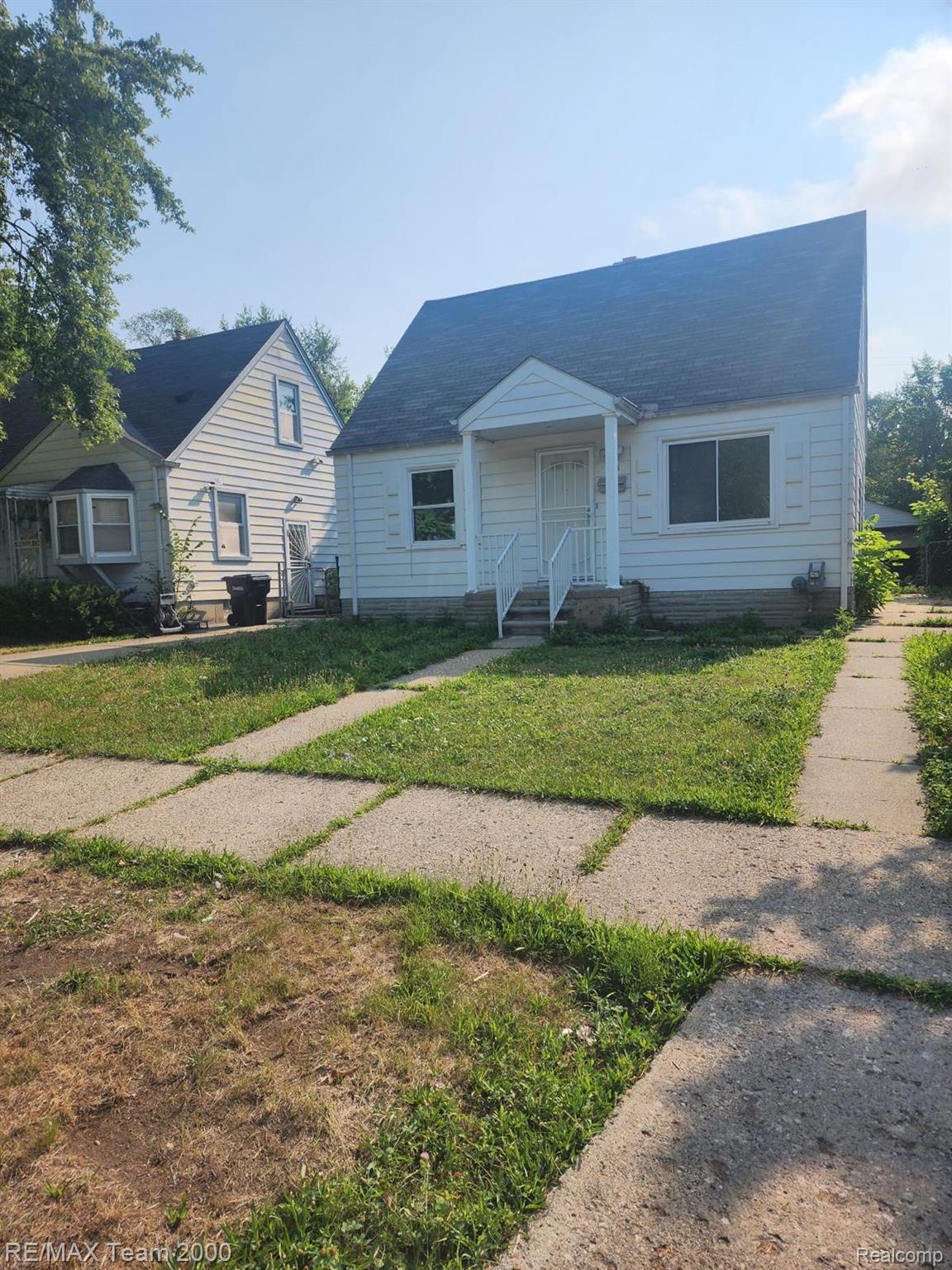 8244 Heyden Detroit, MI 48228 - Photo 1 of 21 Classic white-painted brick exterior with pitched roof and front-gable detailing