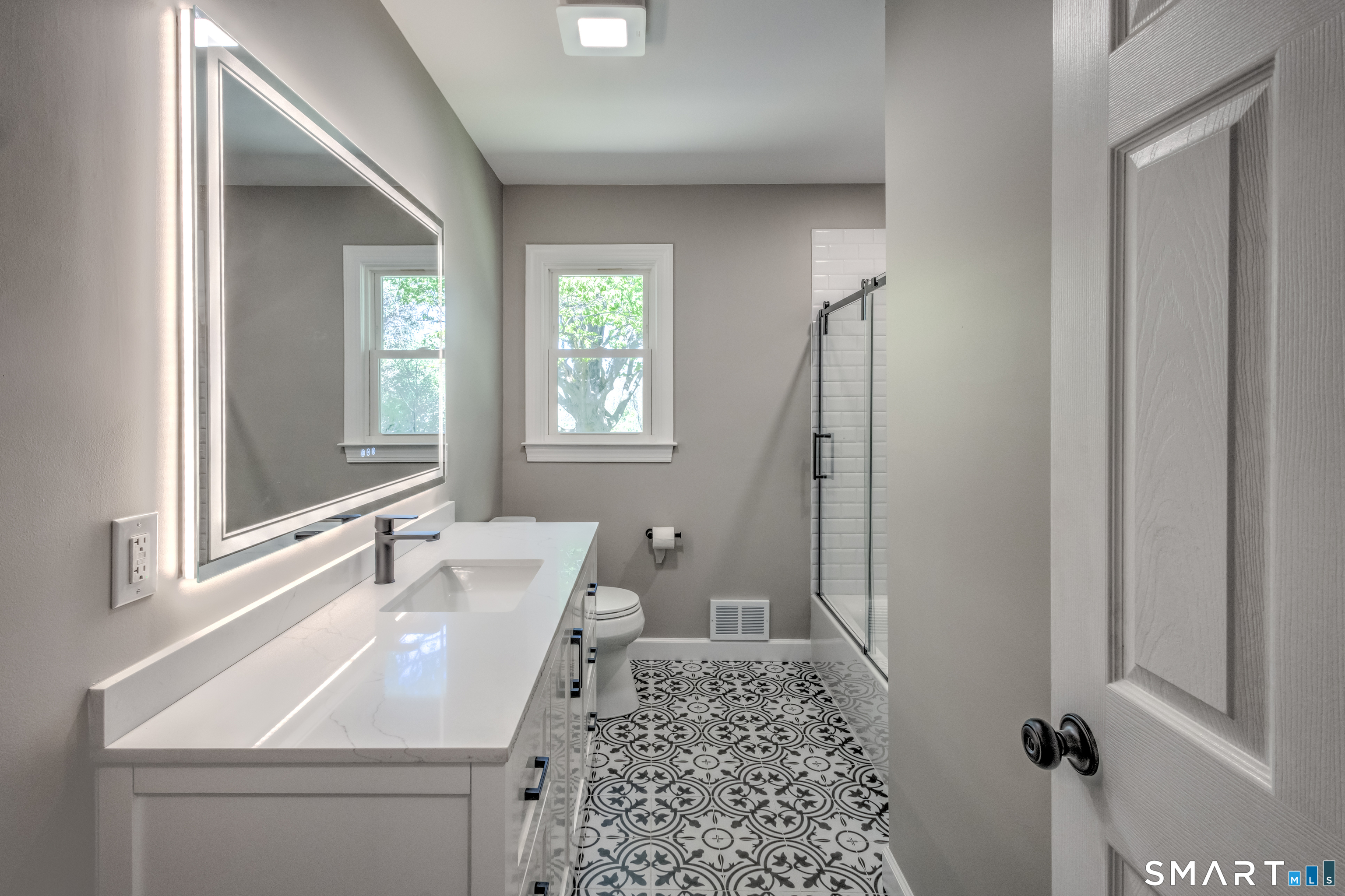 437 Middle Rd Turnpike Woodbury, CT 06798 - Photo 9 of 17 a bathroom with a sink a toilet and vanity