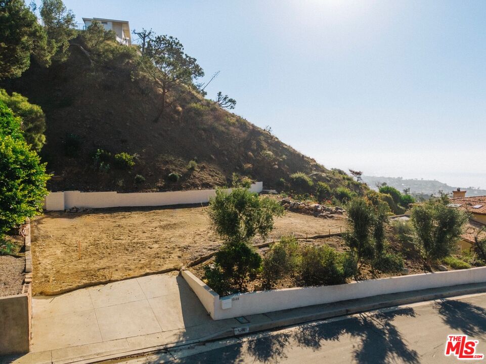 1046 Enchanted Way Pacific Palisades, CA 90272 - Photo 7 of 11 a view of a lake from a balcony