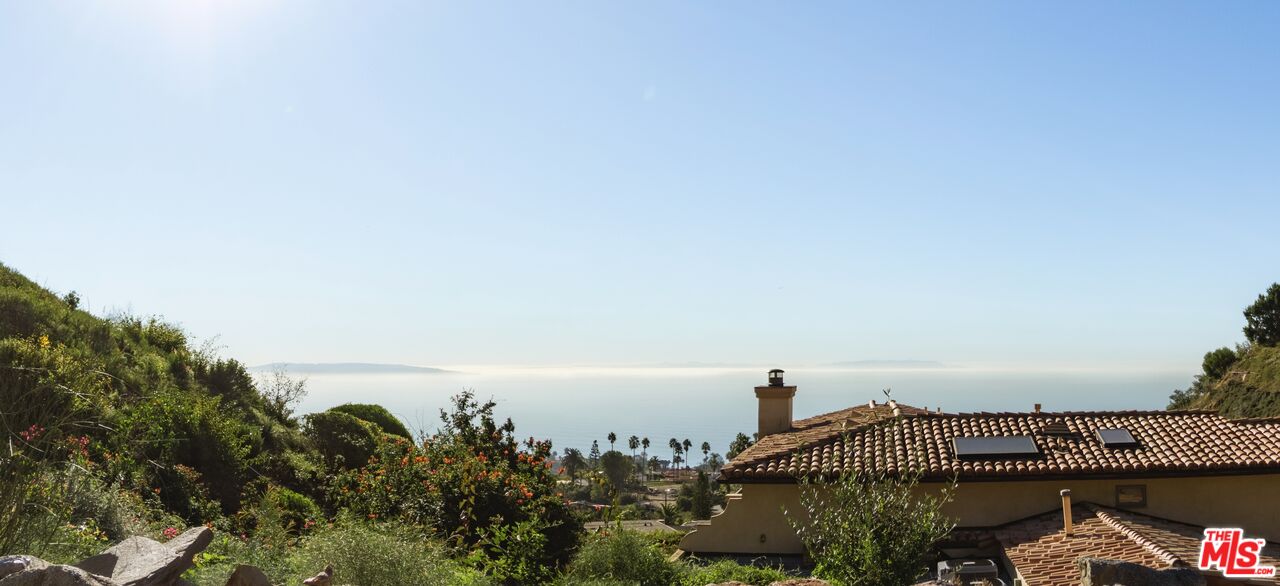 1046 Enchanted Way Pacific Palisades, CA 90272 - Photo 9 of 11 a view of a city and mountain