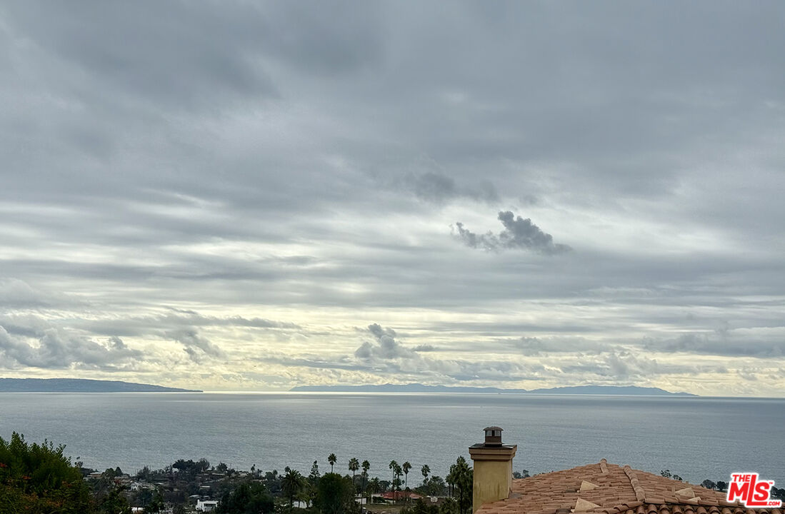 1046 Enchanted Way Pacific Palisades, CA 90272 - Photo 10 of 11 a view of an ocean and beach