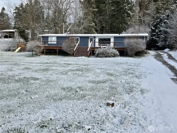 a view of a house with a snow in the yard