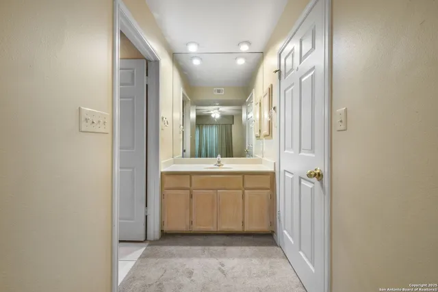 a bathroom with a sink a mirror and a bathtub
