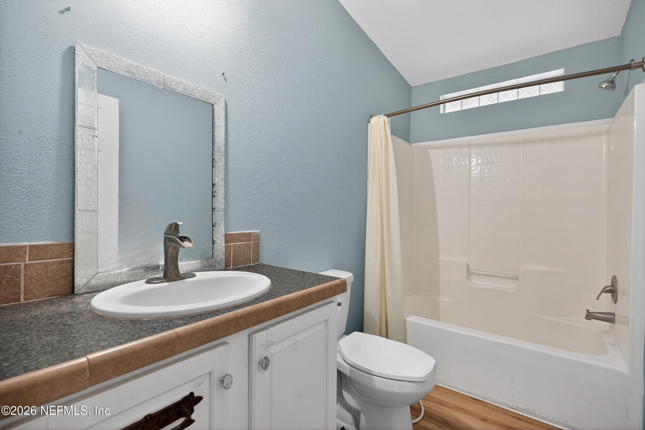 634 Harrison Street Jacksonville, FL 32220 - Photo 18 of 23 a bathroom with a sink a toilet and shower