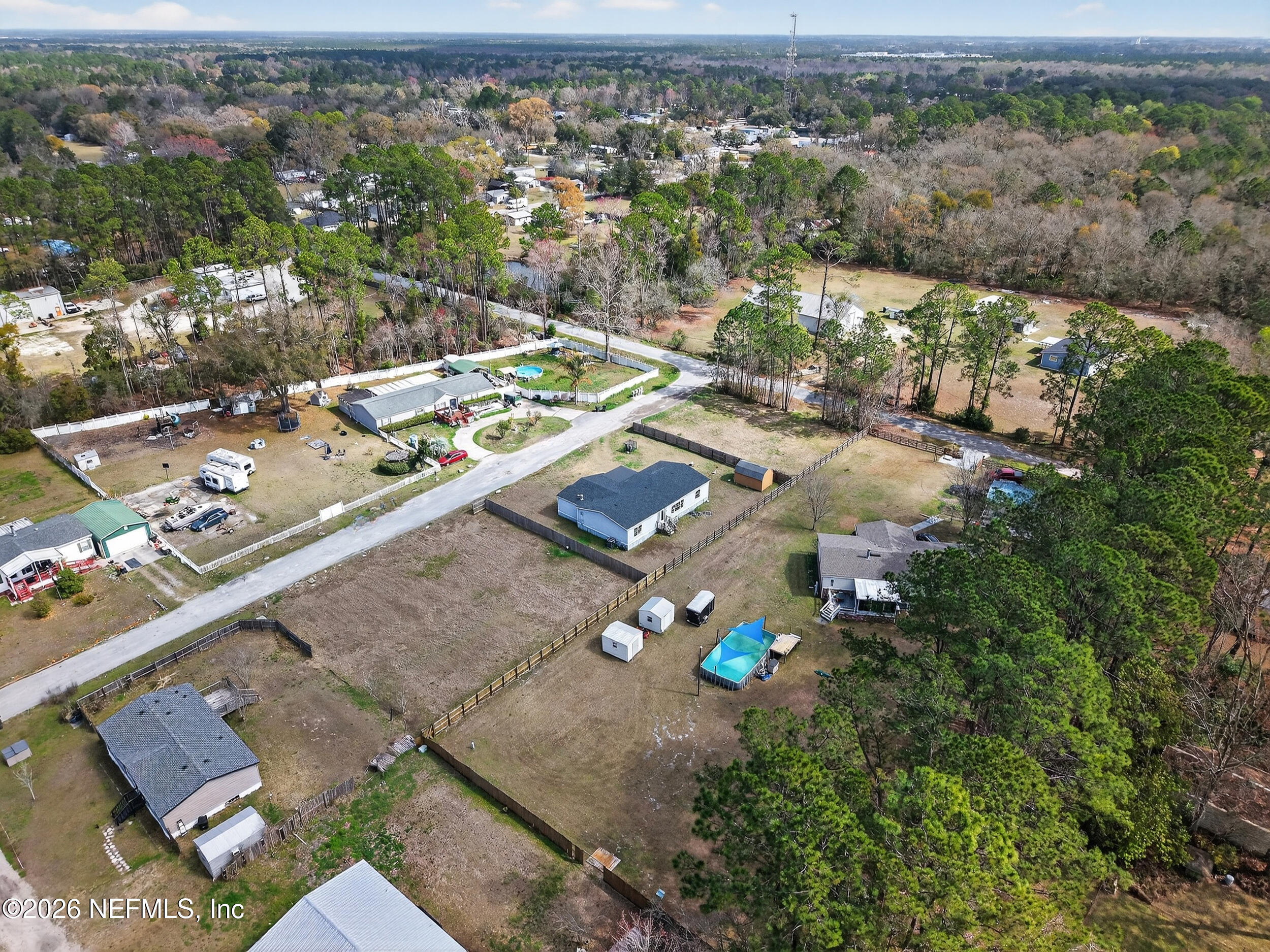 634 Harrison Street Jacksonville, FL 32220 - Photo 22 of 23 an aerial view of a house with a yard