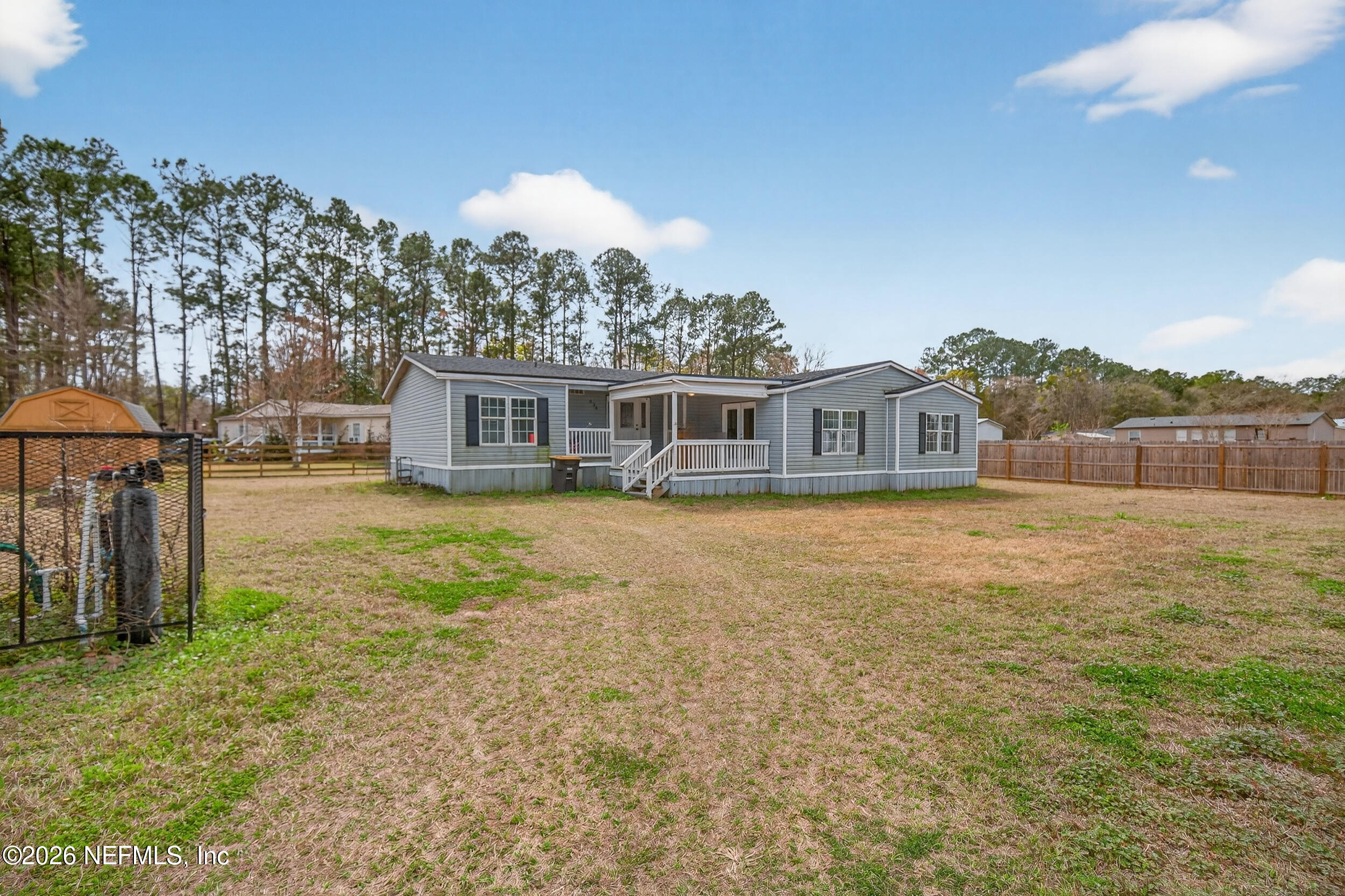 634 Harrison Street Jacksonville, FL 32220 - Photo 3 of 23 a view of a house with a yard