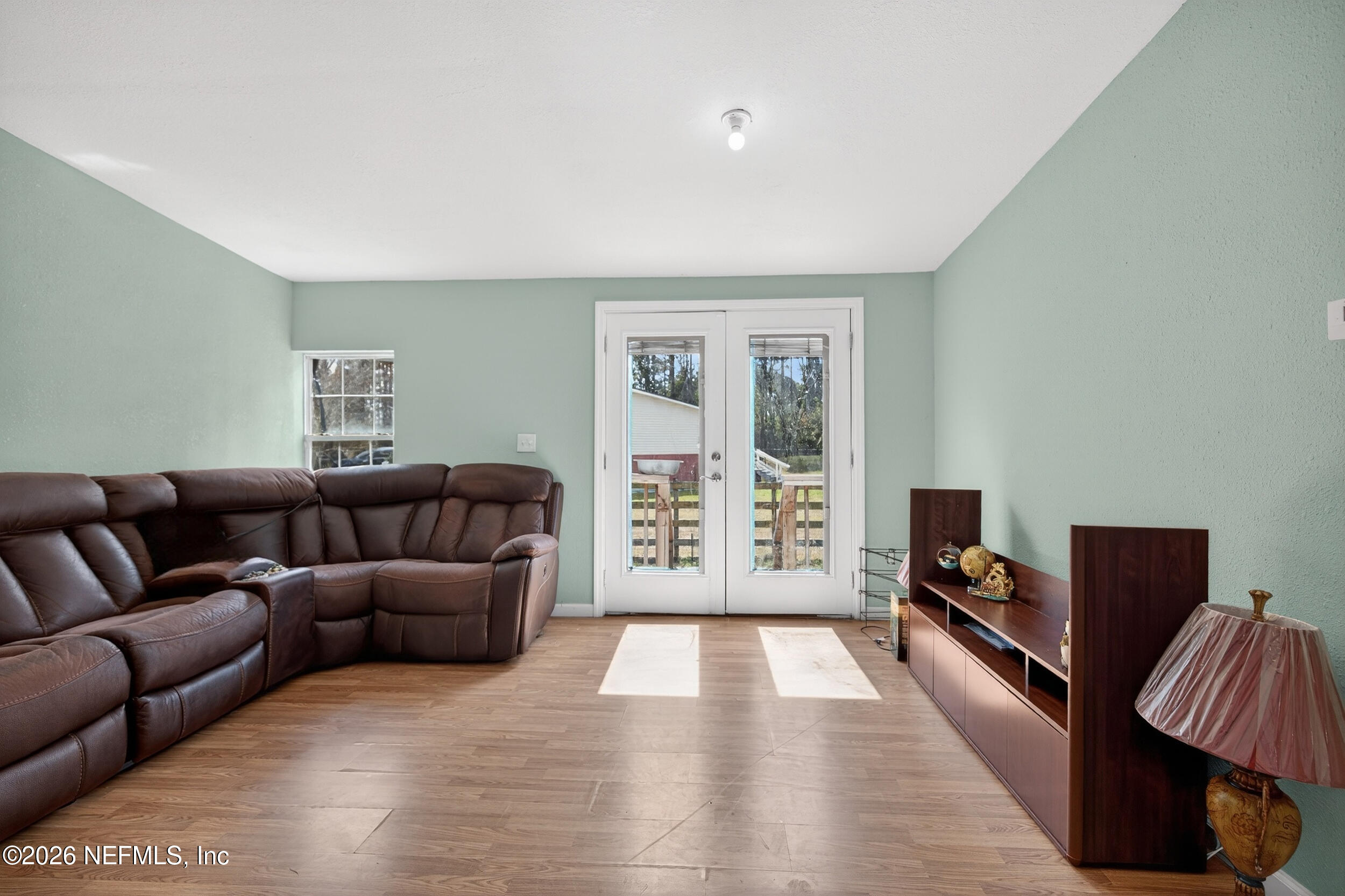 634 Harrison Street Jacksonville, FL 32220 - Photo 5 of 23 a living room with furniture and a window