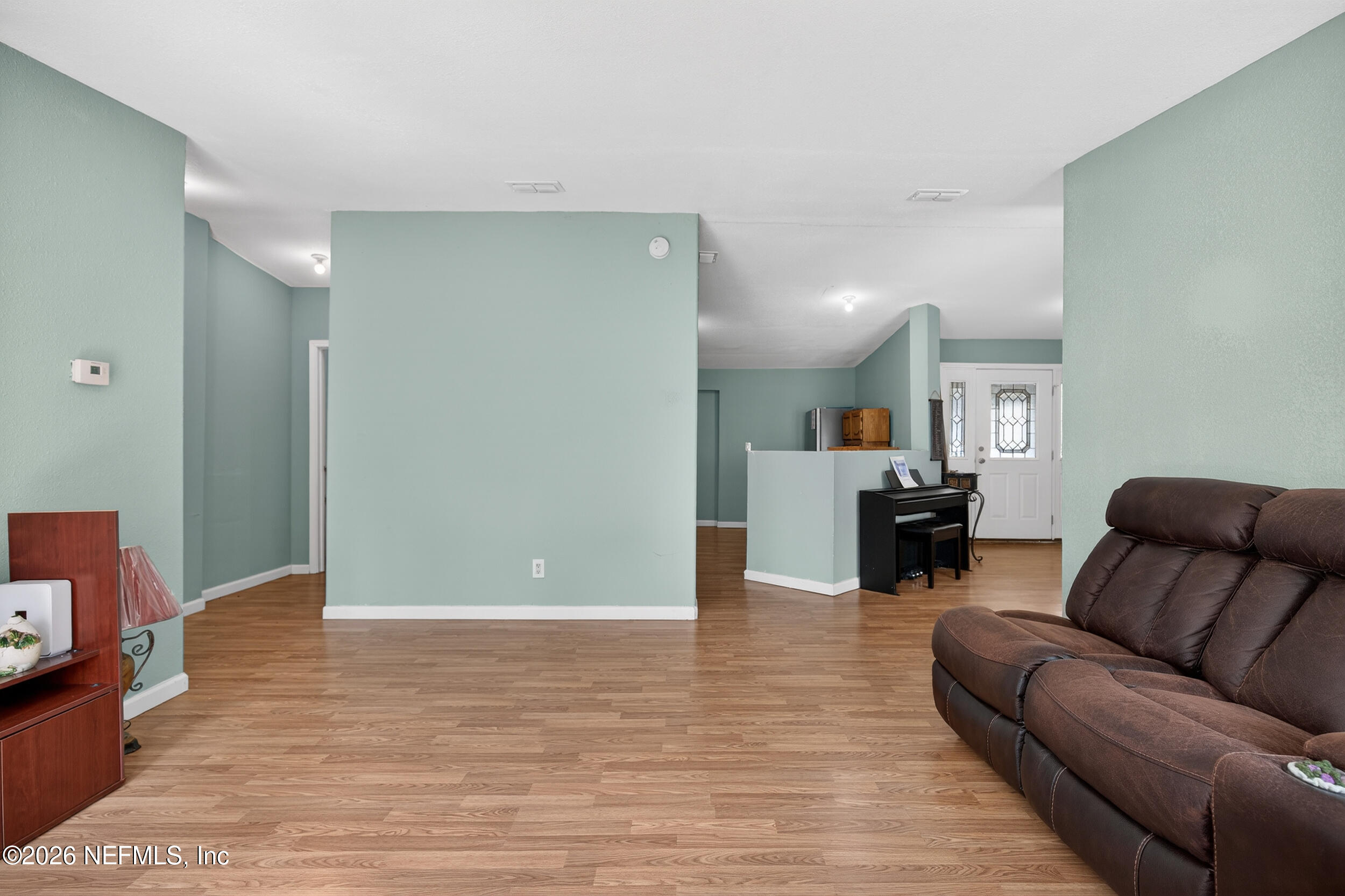 634 Harrison Street Jacksonville, FL 32220 - Photo 6 of 23 a living room with furniture and a wooden floor