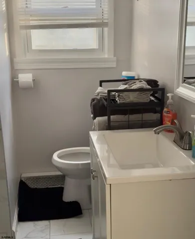 a bathroom with a toilet and a sink