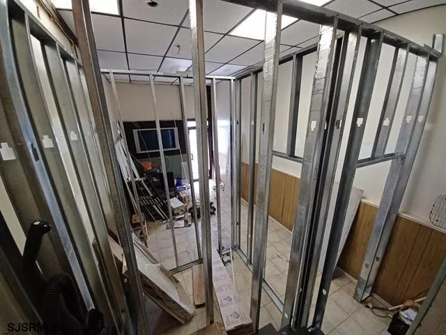 a view of a refrigerator with wooden floor