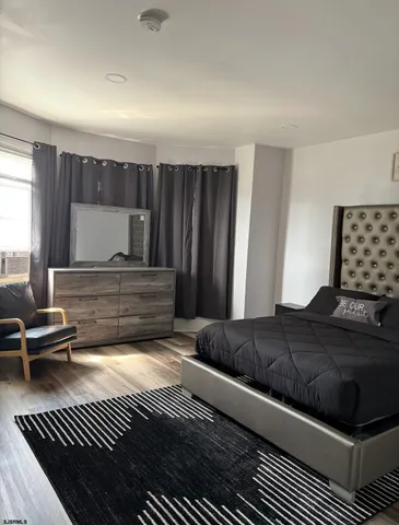 a living room with a couch and a dresser