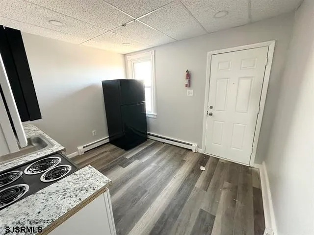 a view of kitchen with wooden floor