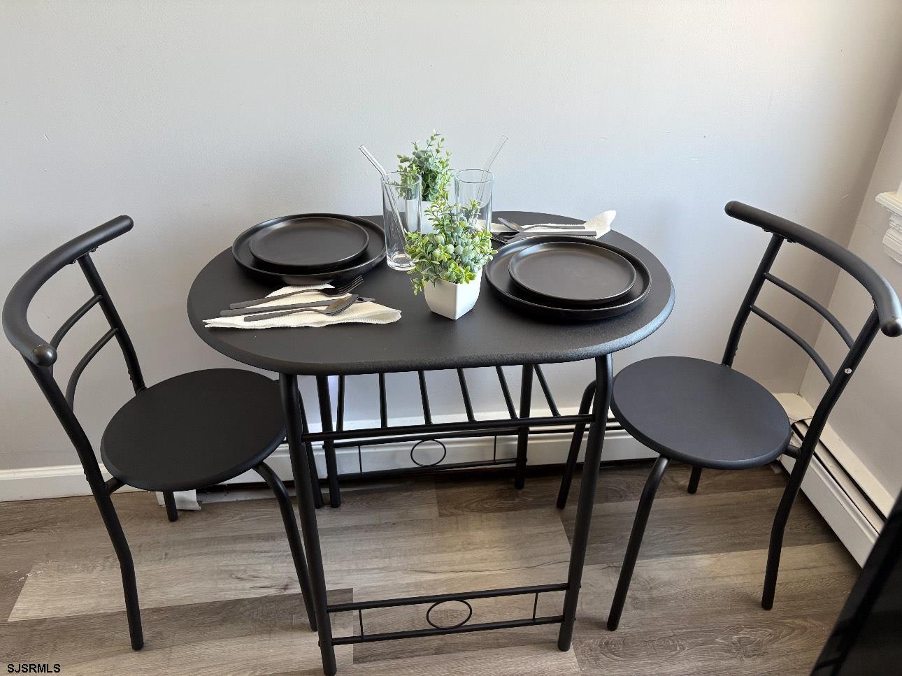 321 Atlantic Avenue Atlantic City, NJ 08401 - Photo 8 of 22 a view of a dining room with furniture and wooden floor