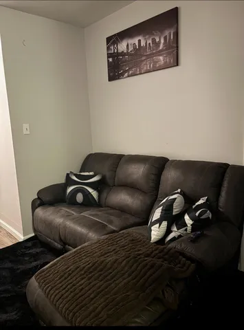 a close up of a couch in a wooden floor