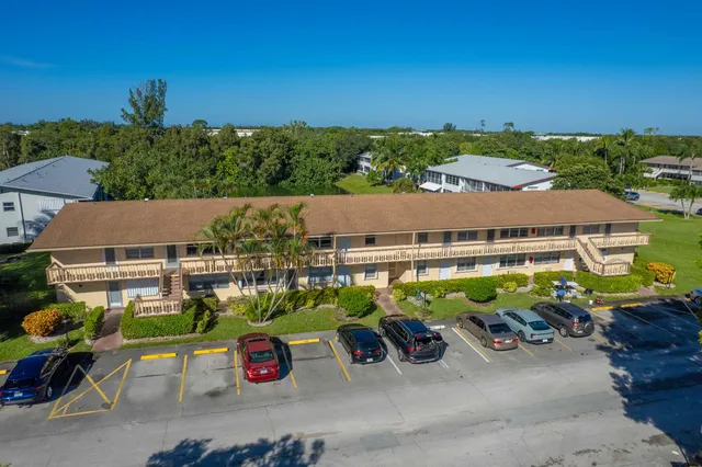 an aerial view of multiple house with outdoor space