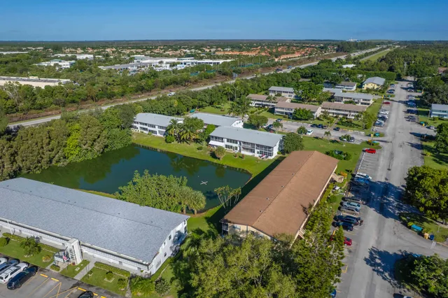 an aerial view of a house with a lake view