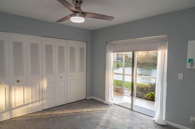 a view of an empty room with glass door