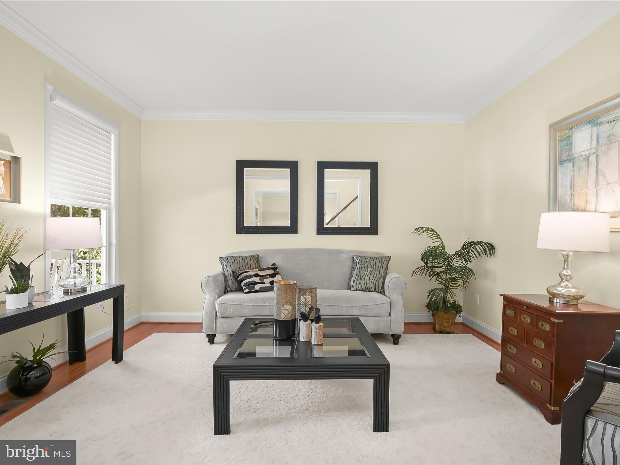 1525 Winfields Lane Gambrills, MD 21054 - Photo 12 of 65 a living room with furniture a lamp paintings and a window