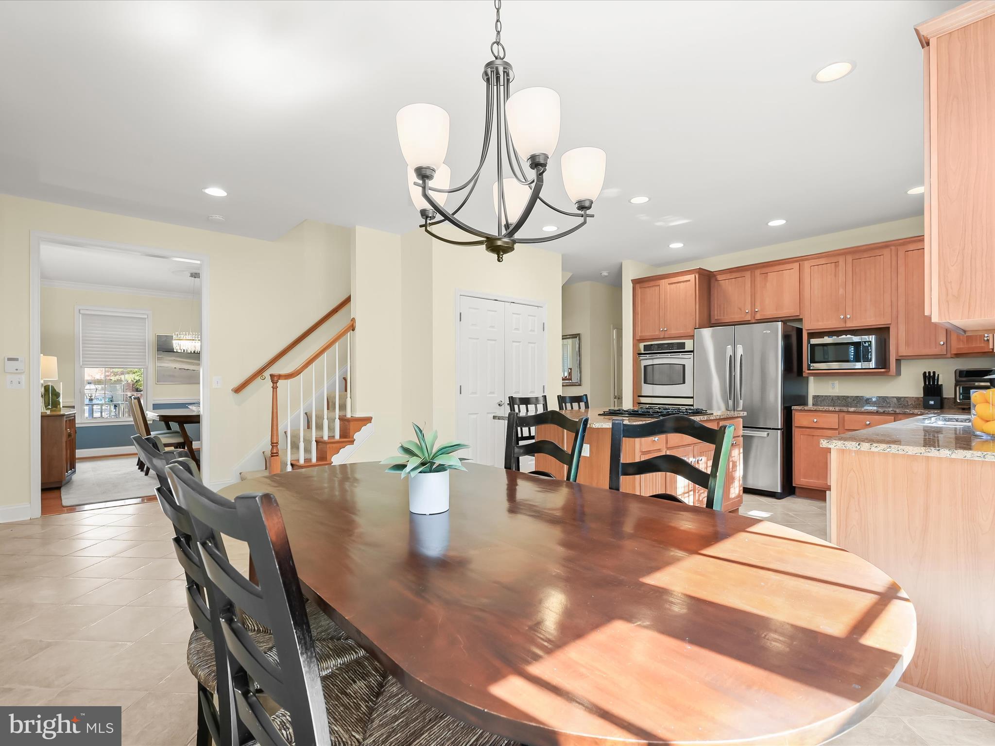 1525 Winfields Lane Gambrills, MD 21054 - Photo 18 of 65 a view of a dining room and livingroom with furniture wooden floor a chandelier