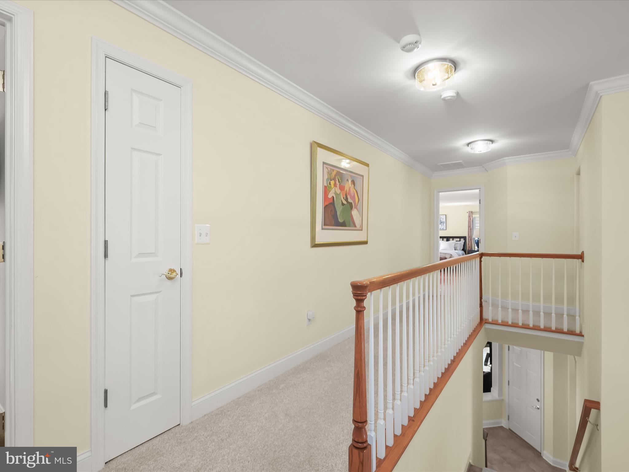 1525 Winfields Lane Gambrills, MD 21054 - Photo 30 of 65 a view of staircase with lots of frames on wall and a window