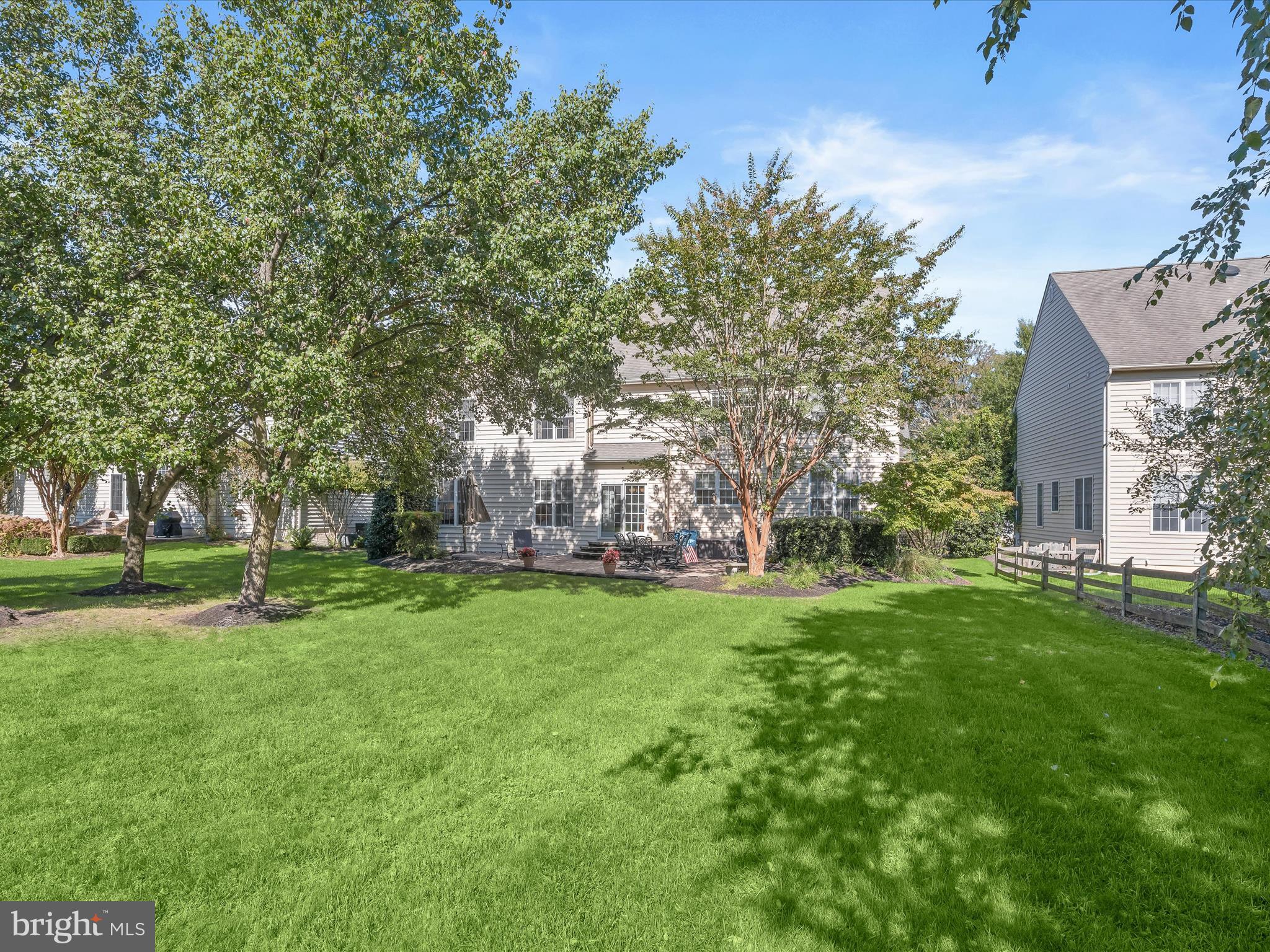 1525 Winfields Lane Gambrills, MD 21054 - Photo 53 of 65 a backyard of a house with table and chairs