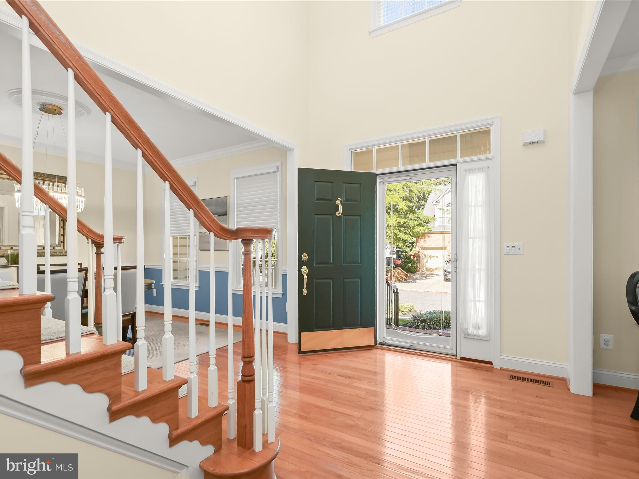 1525 Winfields Lane Gambrills, MD 21054 - Photo 8 of 65 a view of an entryway with wooden floor and door