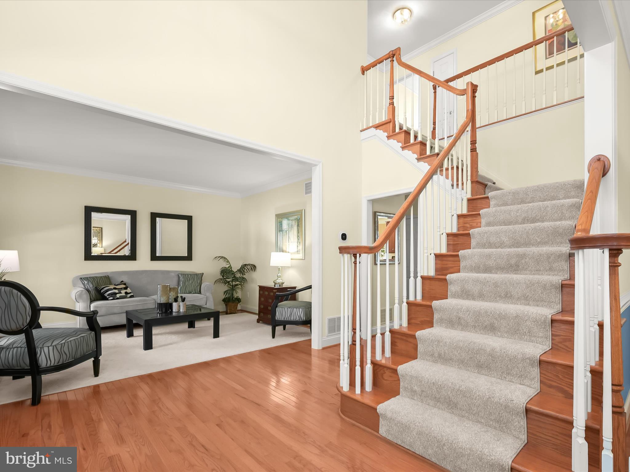 1525 Winfields Lane Gambrills, MD 21054 - Photo 10 of 65 a living room with furniture and a dining table with wooden floor