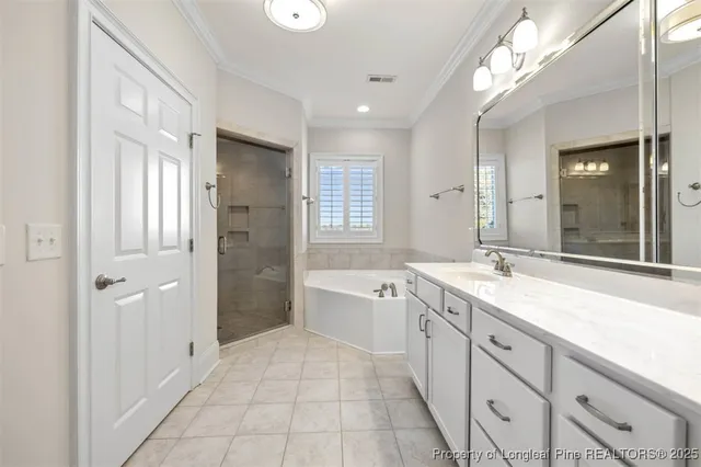 a spacious bathroom with a shower sink double and mirror