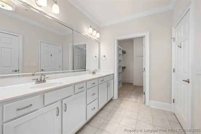 a spacious bathroom with a granite countertop sink a mirror and a