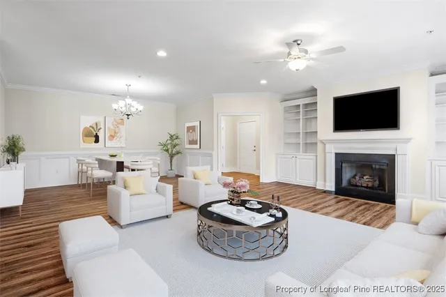 a living room with furniture a fireplace and a flat screen tv