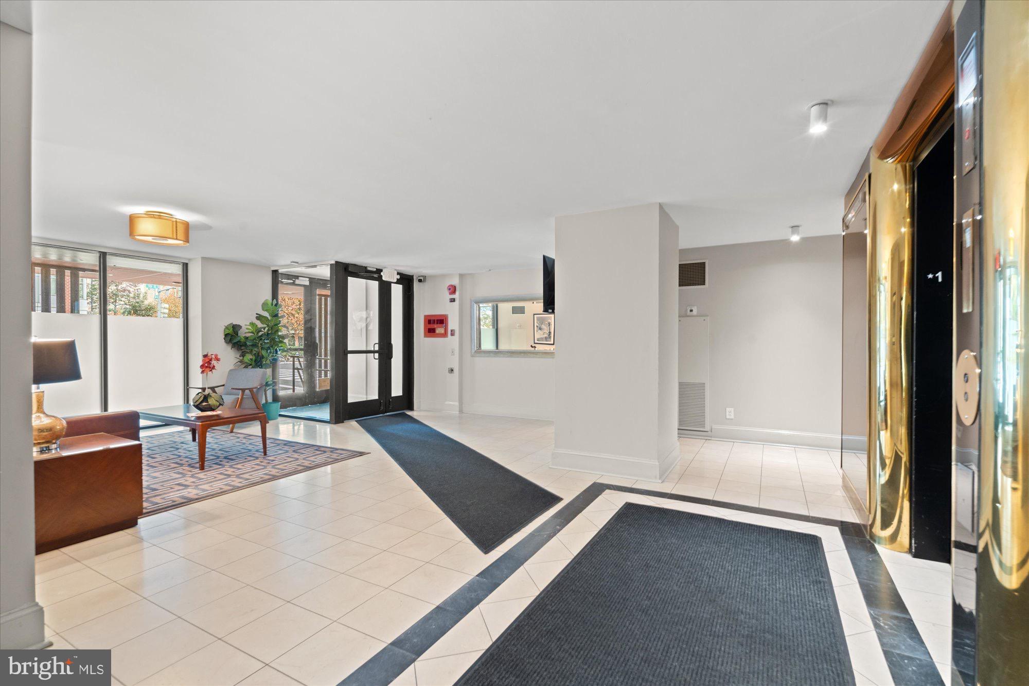 1245 13th Street Northwest, Unit 508 Washington, DC 20005 - Photo 14 of 15 a living room with furniture and large window