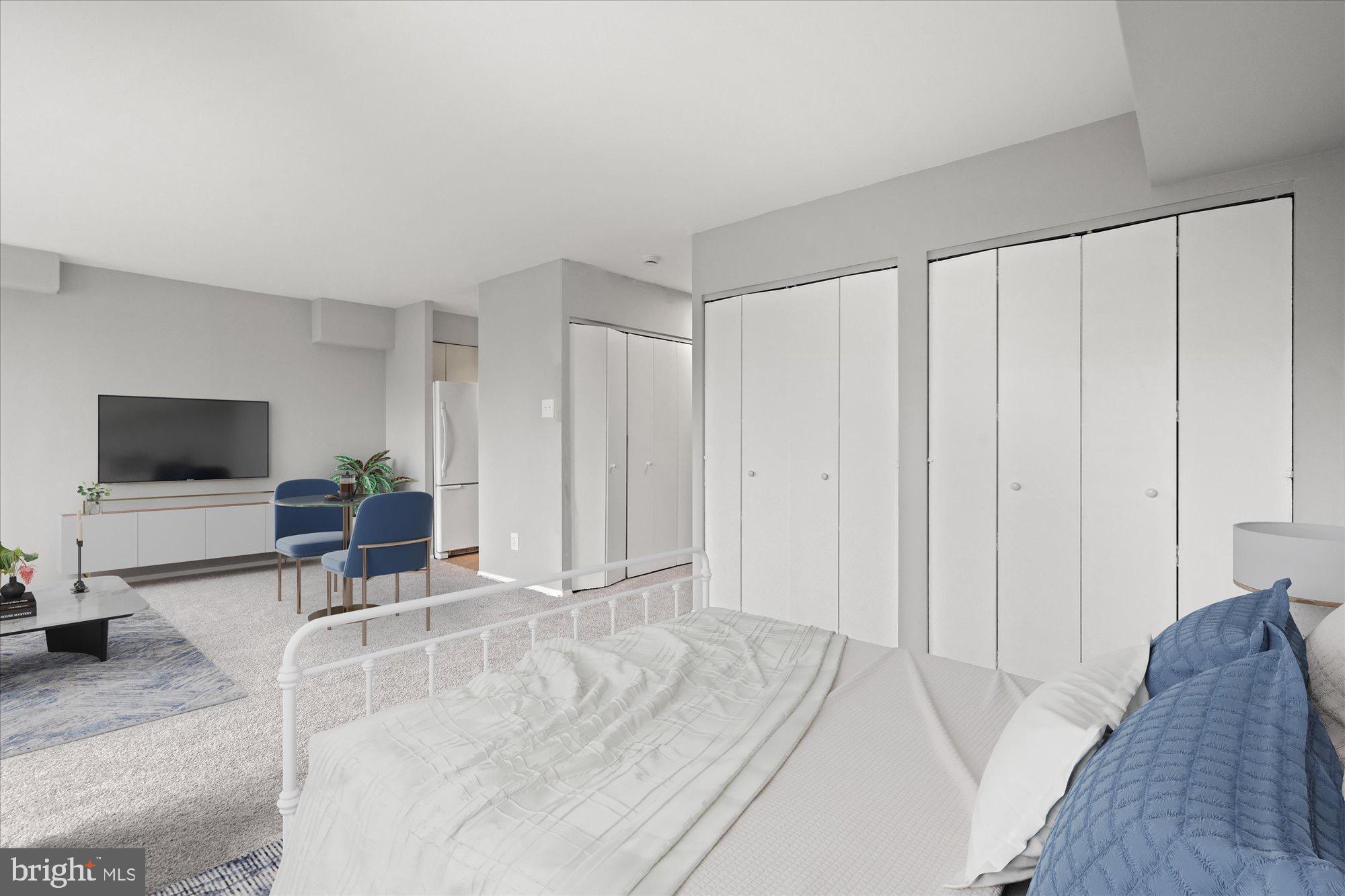 1245 13th Street Northwest, Unit 508 Washington, DC 20005 - Photo 5 of 15 a living room with furniture and a flat screen tv