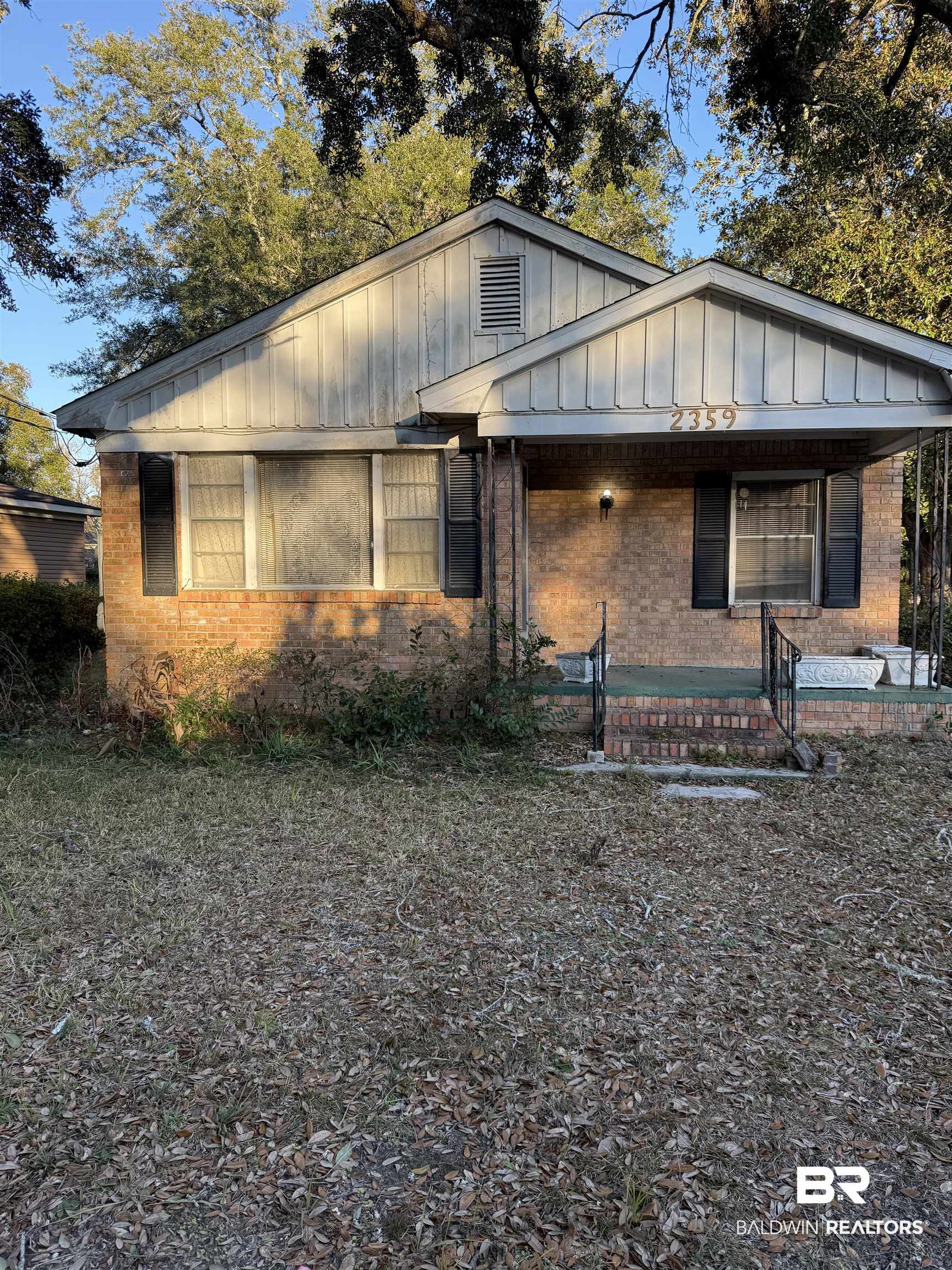 2359 Demetropolis Road Mobile, AL 36693 - Photo 1 of 8 Bungalow with board and batten siding, covered porch, and brick siding