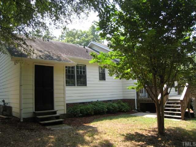 5208 Badham Place Raleigh, NC 27609 - Photo 11 of 12 a front view of a house with garden