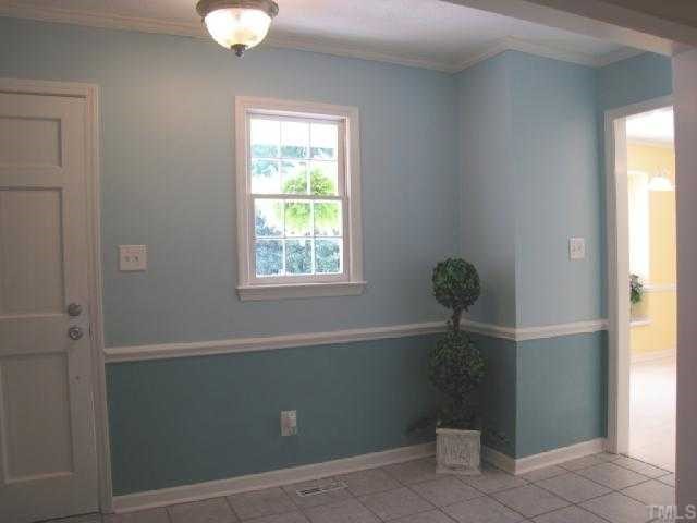5208 Badham Place Raleigh, NC 27609 - Photo 2 of 12 a view of a small space with wooden floor and a window