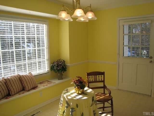 5208 Badham Place Raleigh, NC 27609 - Photo 3 of 12 a living room with furniture and a large window