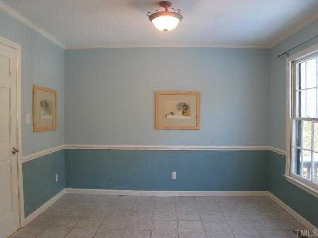5208 Badham Place Raleigh, NC 27609 - Photo 5 of 12 an empty room with windows