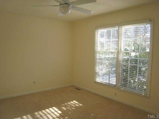 5208 Badham Place Raleigh, NC 27609 - Photo 8 of 12 a view of an empty room with a window