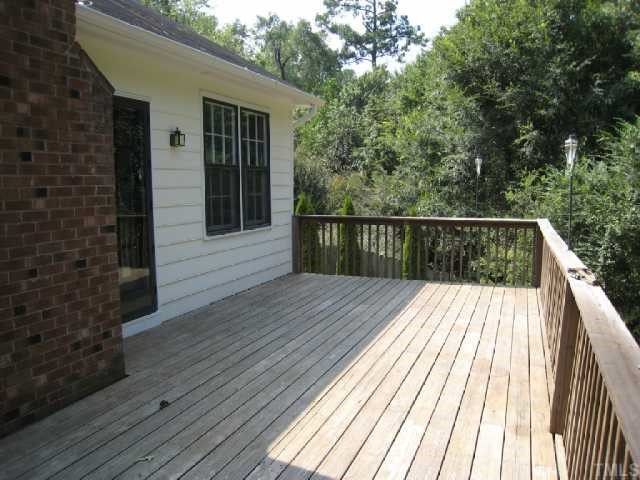 5208 Badham Place Raleigh, NC 27609 - Photo 9 of 12 a view of balcony with wooden floor and fence