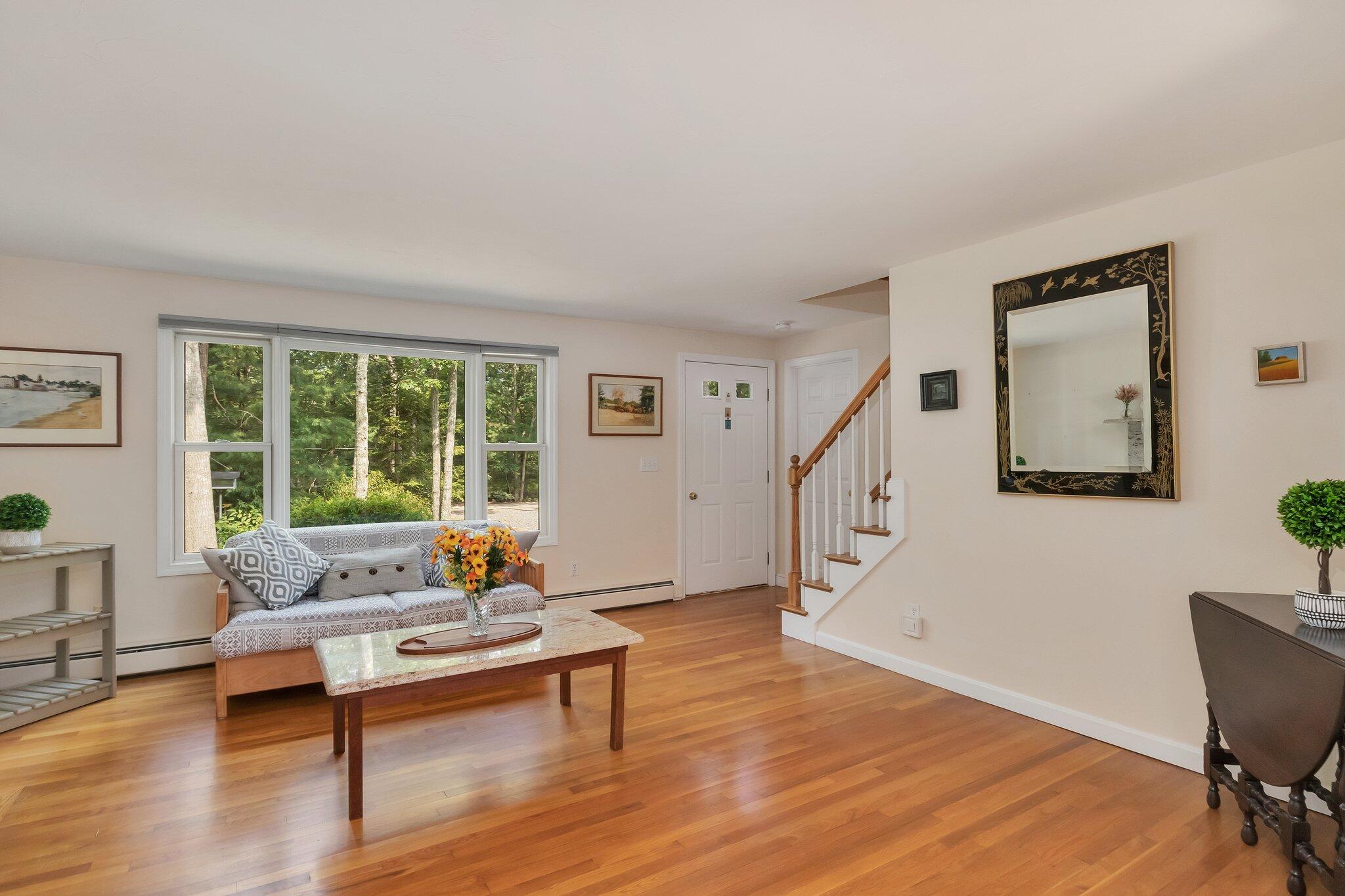565 Sampsons Mill Road Cotuit, MA 02635 - Photo 13 of 87 a living room with furniture and a wooden floor