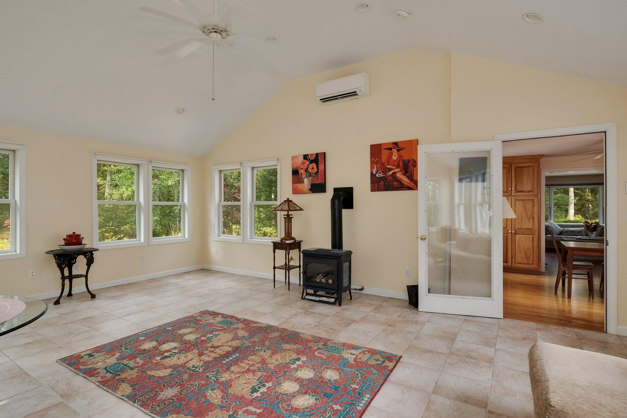 565 Sampsons Mill Road Cotuit, MA 02635 - Photo 23 of 87 a living room with furniture and a rug
