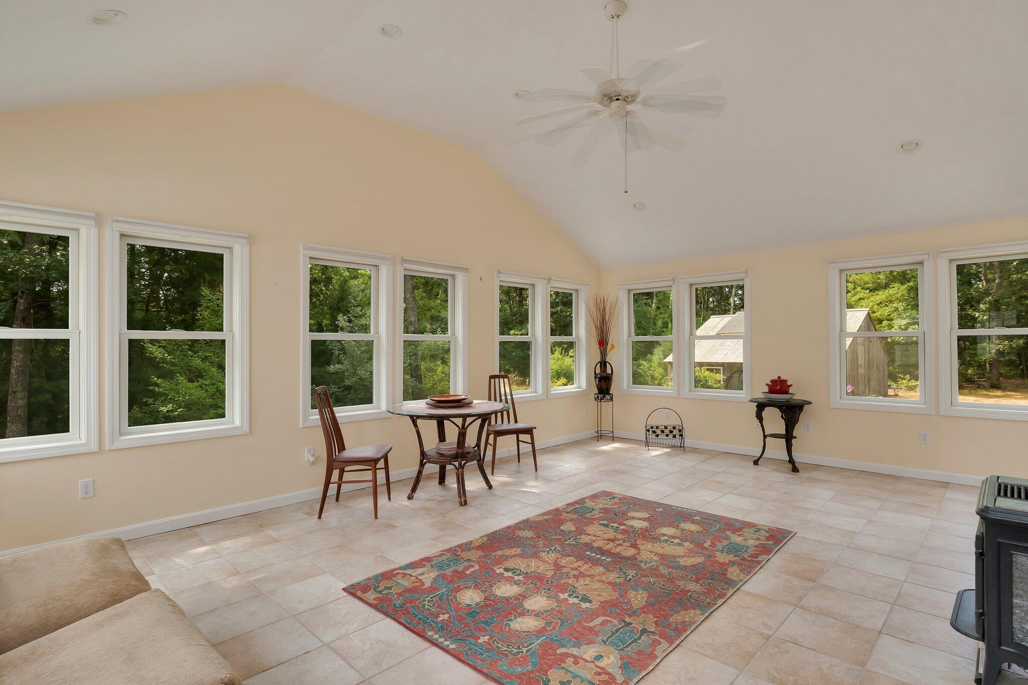565 Sampsons Mill Road Cotuit, MA 02635 - Photo 24 of 87 a living room with furniture a window and a rug