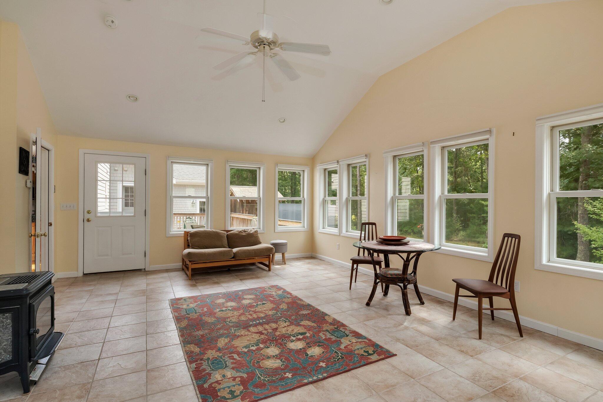 565 Sampsons Mill Road Cotuit, MA 02635 - Photo 26 of 87 a living room with furniture and a large window