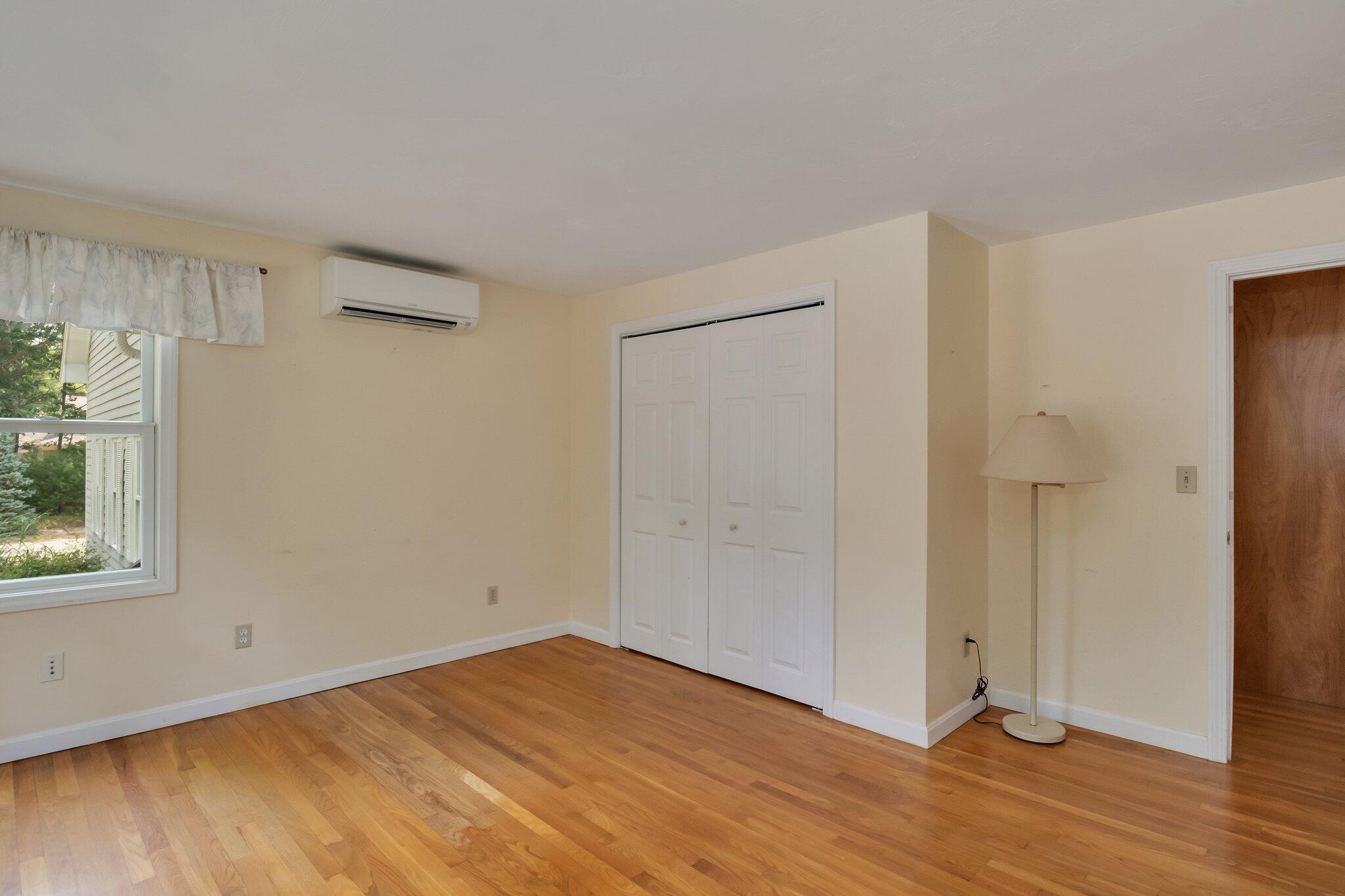 565 Sampsons Mill Road Cotuit, MA 02635 - Photo 34 of 87 a view of empty room with wooden floor and fan