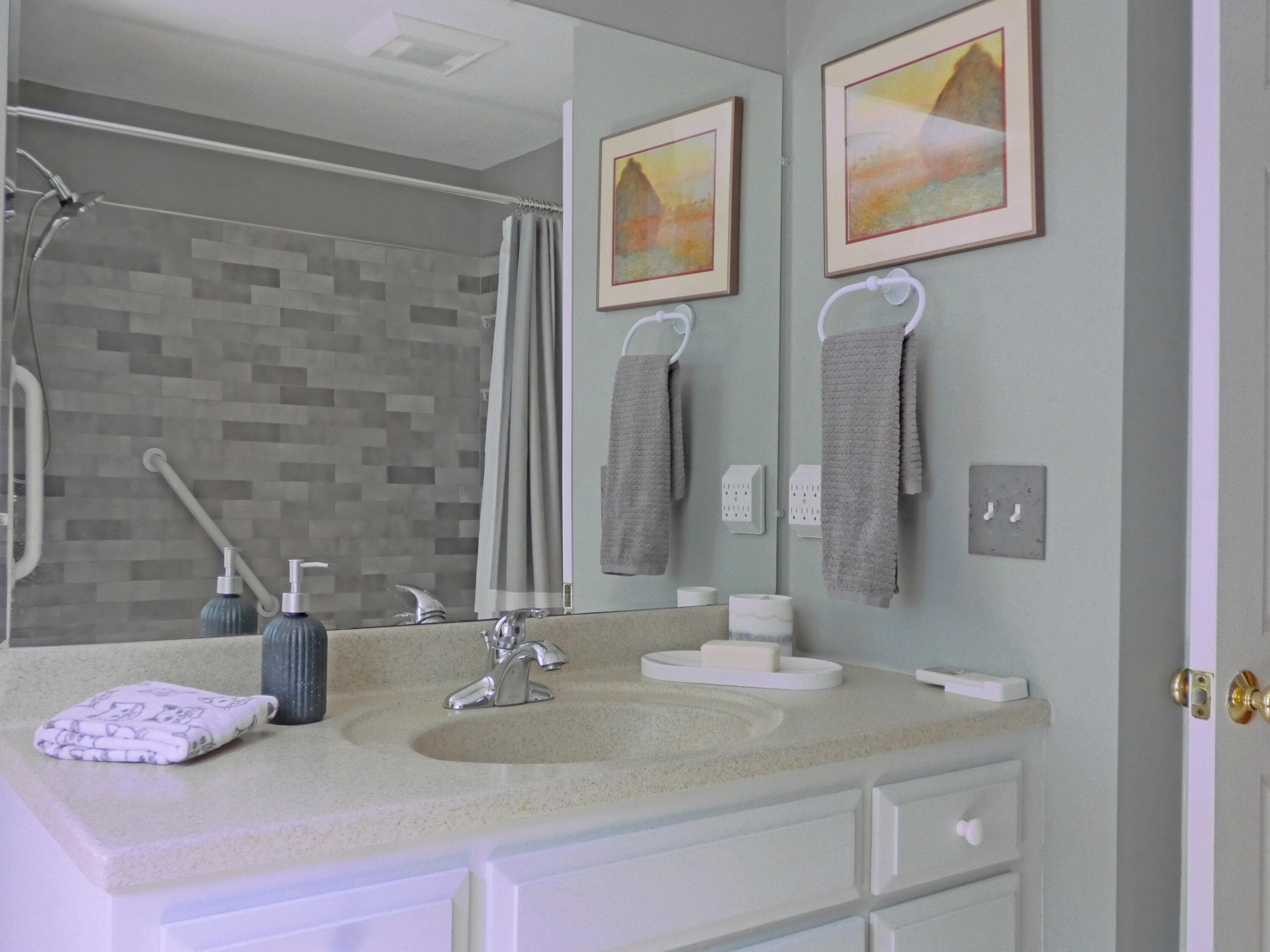 565 Sampsons Mill Road Cotuit, MA 02635 - Photo 48 of 87 a bathroom with a sink and a mirror