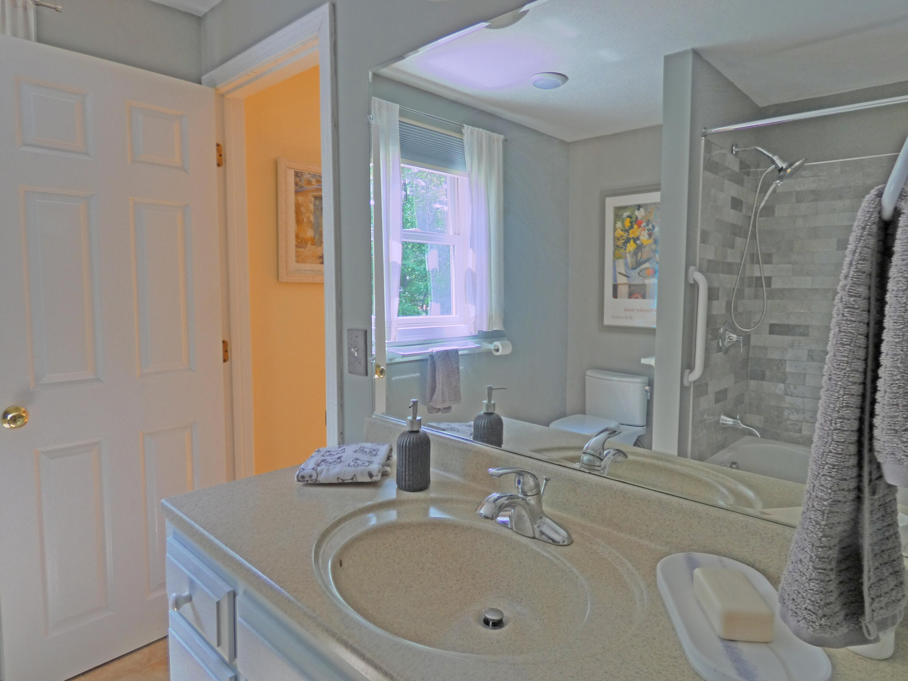 565 Sampsons Mill Road Cotuit, MA 02635 - Photo 49 of 87 a bathroom with a granite countertop sink a mirror and shower