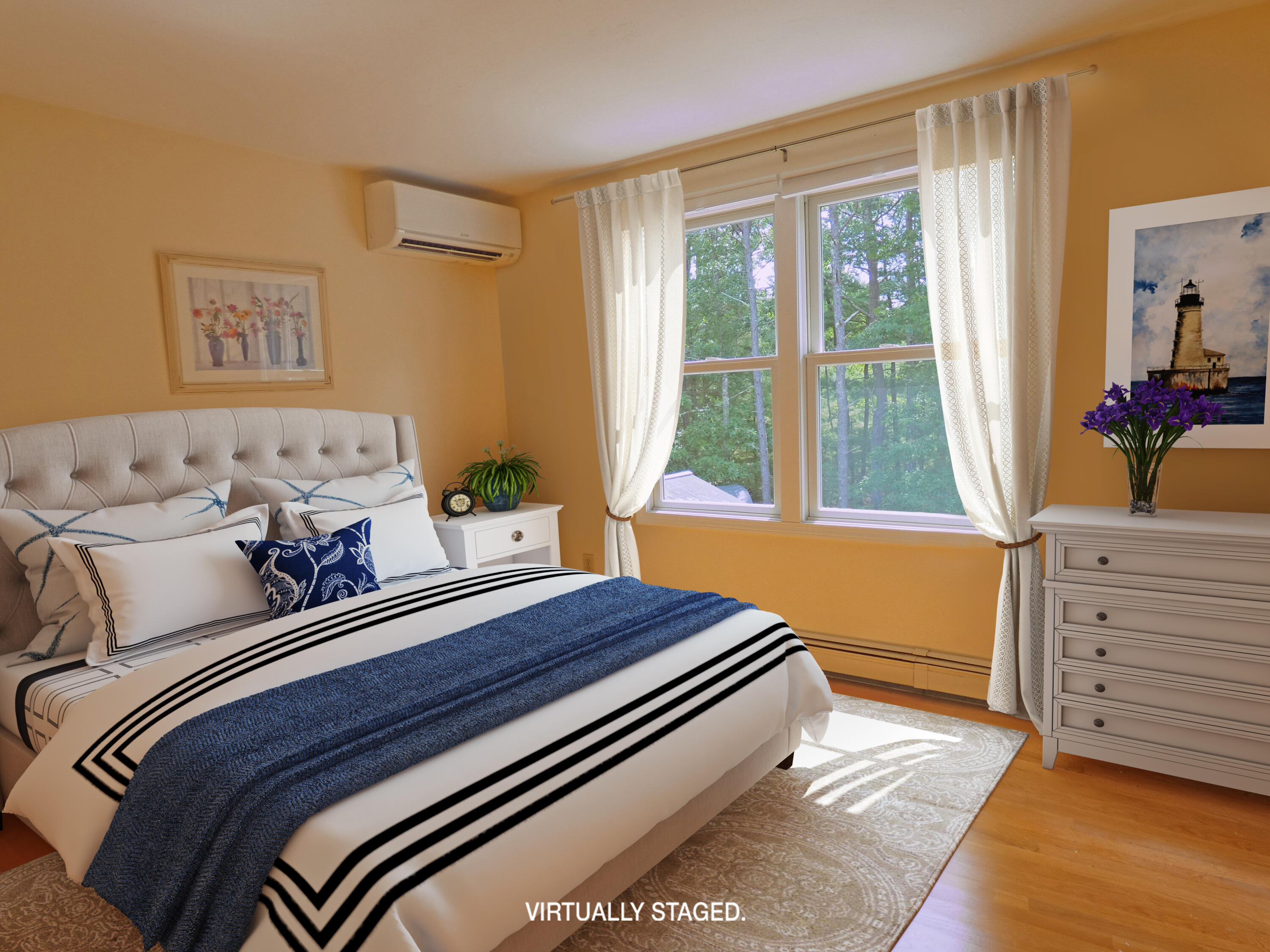 565 Sampsons Mill Road Cotuit, MA 02635 - Photo 51 of 87 a bedroom with a bed and wooden floor
