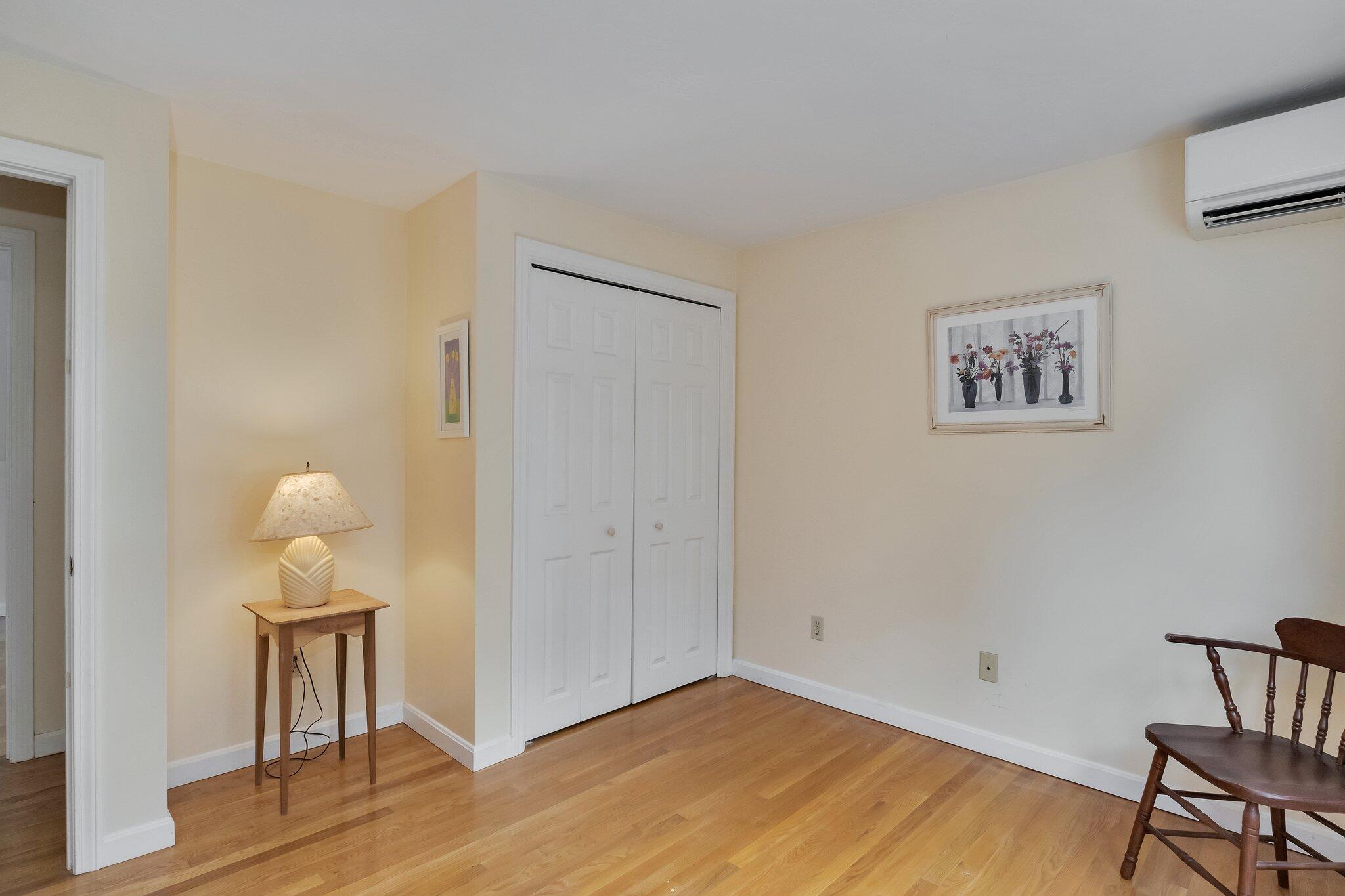 565 Sampsons Mill Road Cotuit, MA 02635 - Photo 54 of 87 a view of a hallway with wooden floor
