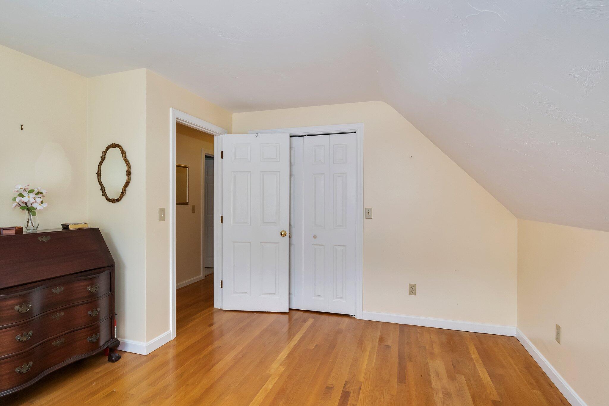 565 Sampsons Mill Road Cotuit, MA 02635 - Photo 57 of 87 a view of a room with wooden floor and white walls