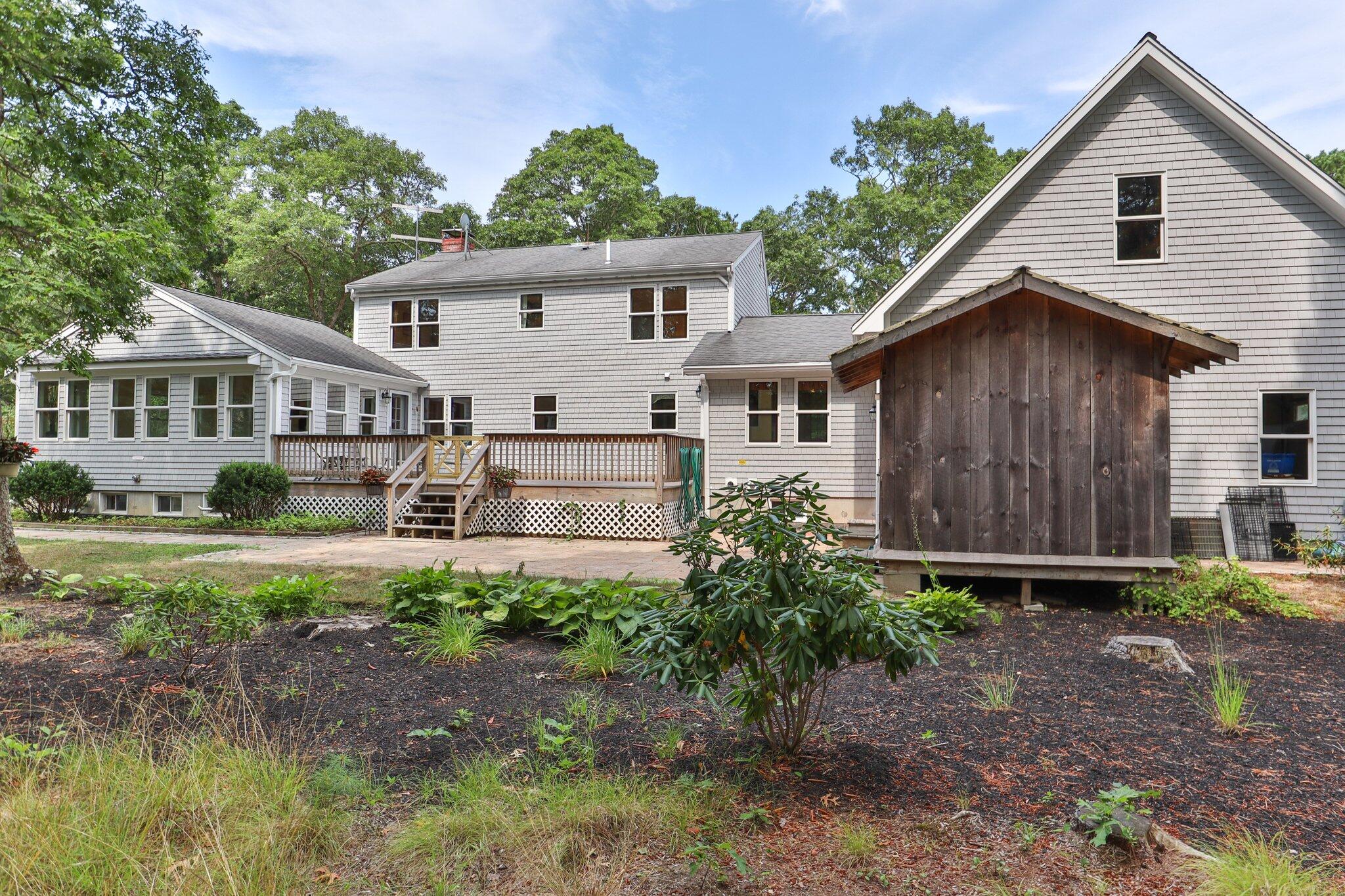 565 Sampsons Mill Road Cotuit, MA 02635 - Photo 79 of 87 a view of a house with backyard and garden